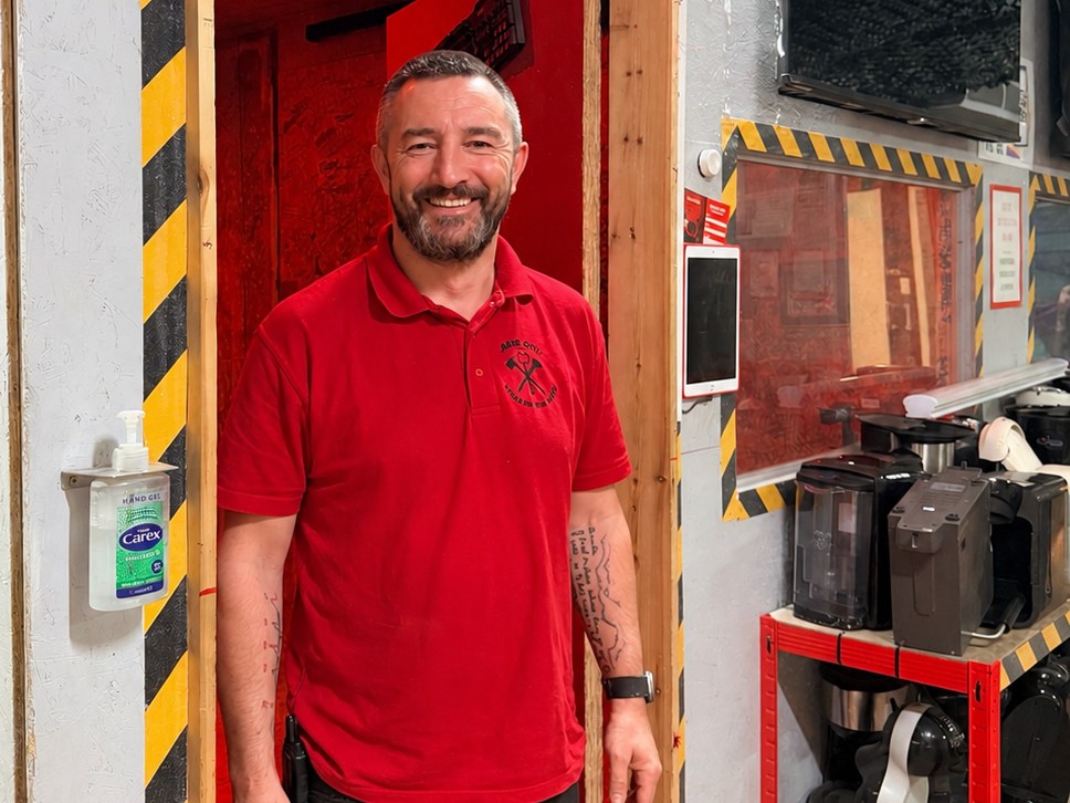 VenueBookr's founder at the door of a rage room in the venue he runs